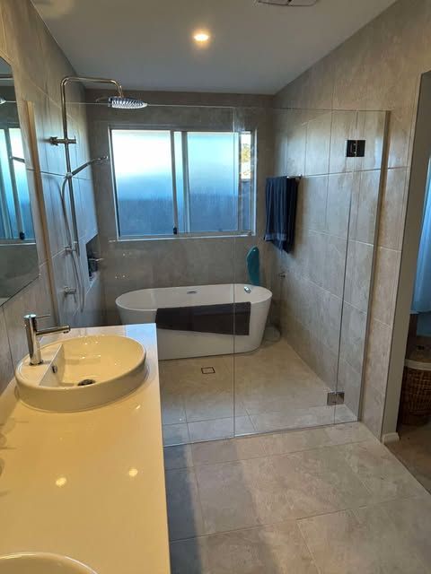 Modern Bathroom with A Glass Shower, Soaking Tub, and A Vanity — Envy Glass in Nambucca Heads, NSW