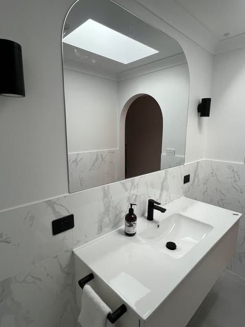 Bathroom with White Vanity and Large Arched Mirror — Envy Glass in Nambucca Heads, NSW