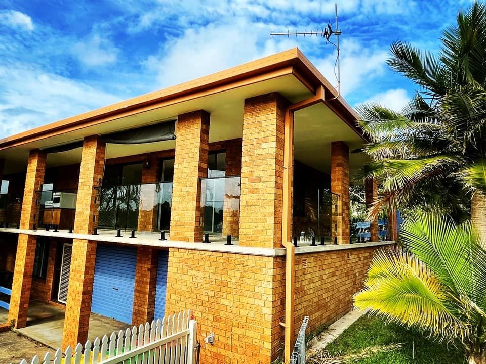 A Brick House with Columns — Envy Glass in Nambucca Heads, NSW