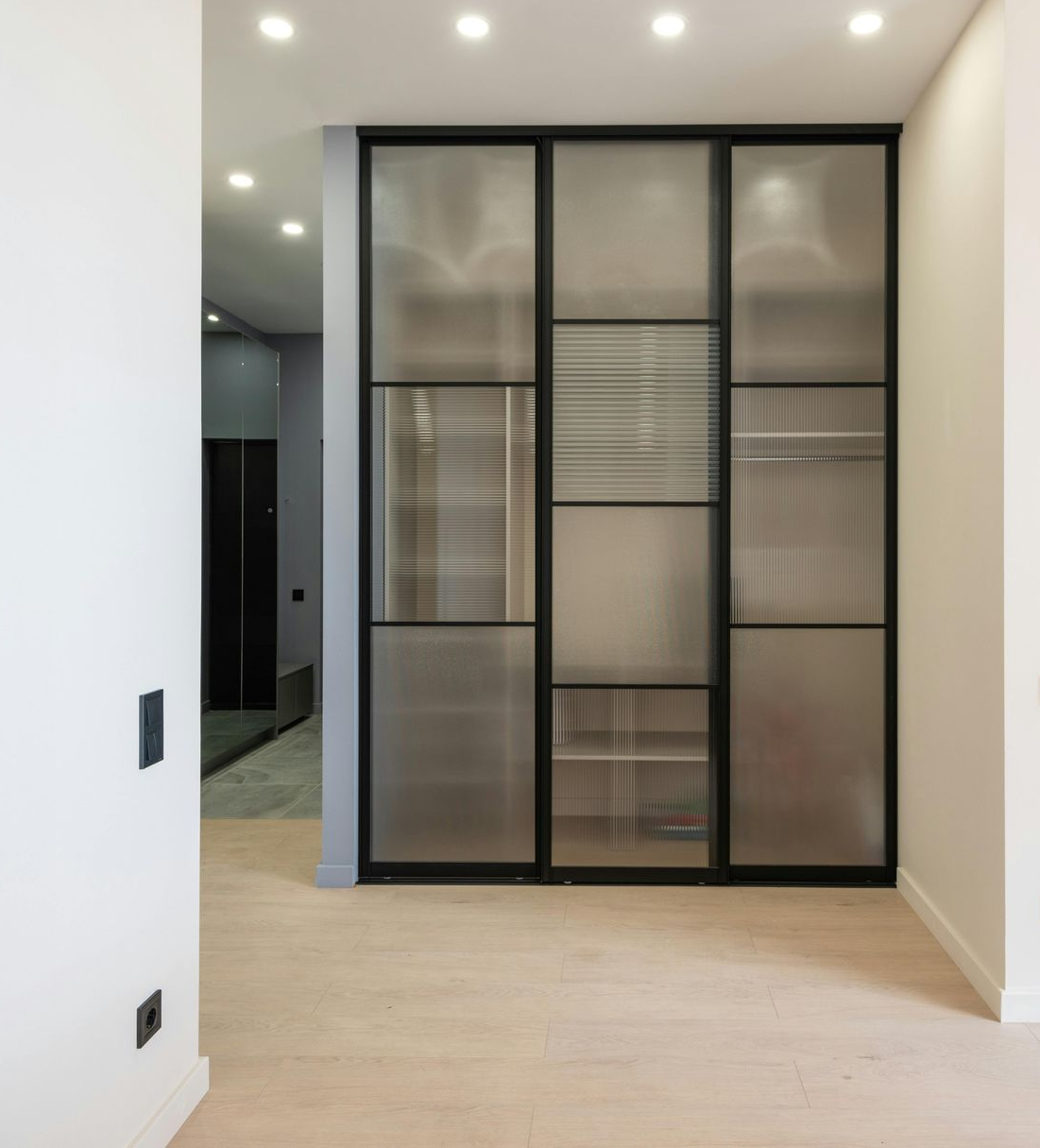 Glass and black metal wardrober doors with frosted and textured panels — Envy Glass in Nambucca Heads, NSW