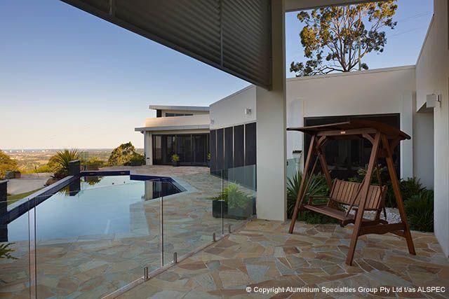 Patio With Swimming Pool, Swing, And Modern Home — Envy Glass in Bellingen, NSW