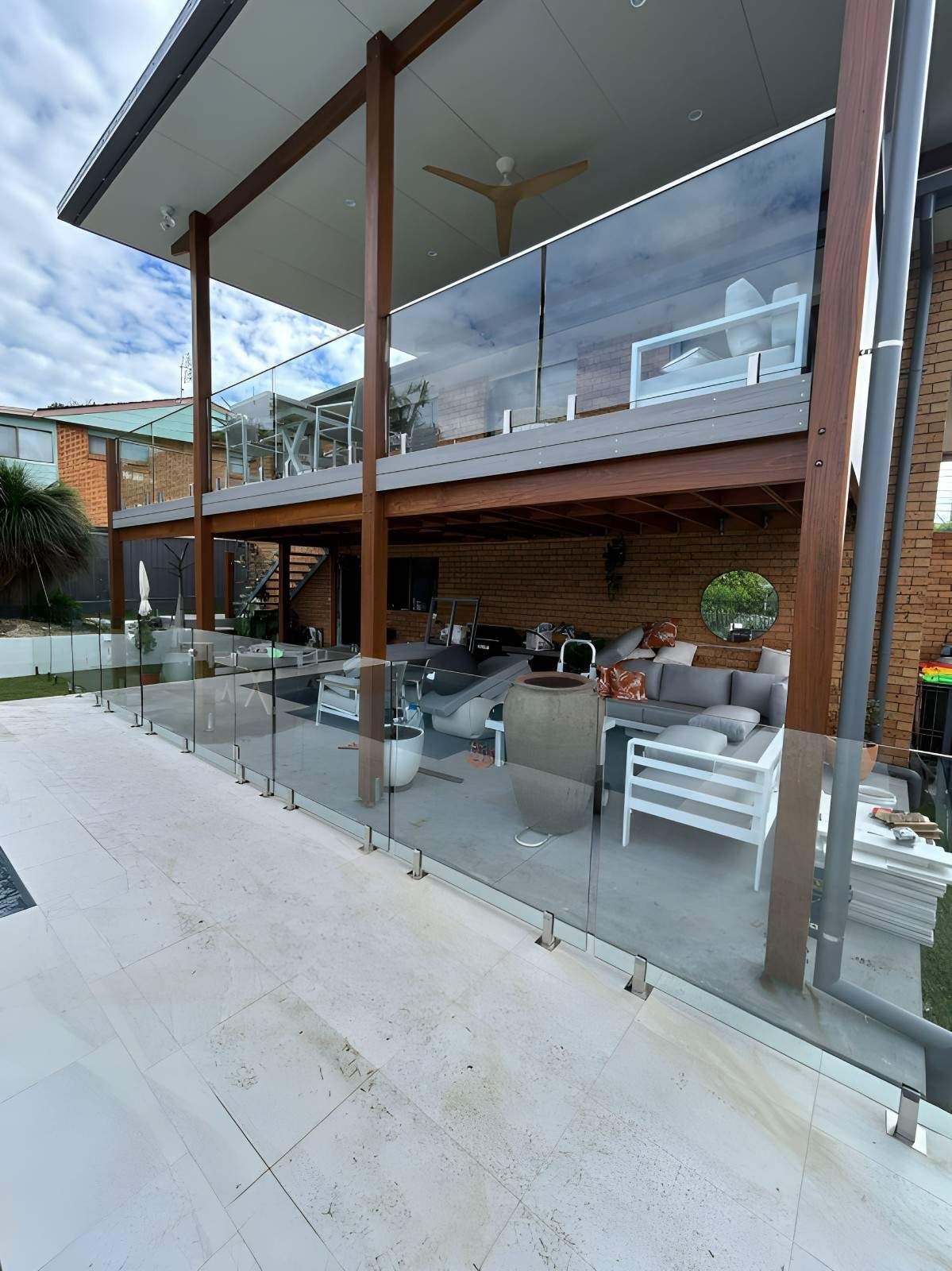 An Outdoor Patio with Glass Railings — Envy Glass in Urunga, NSW
