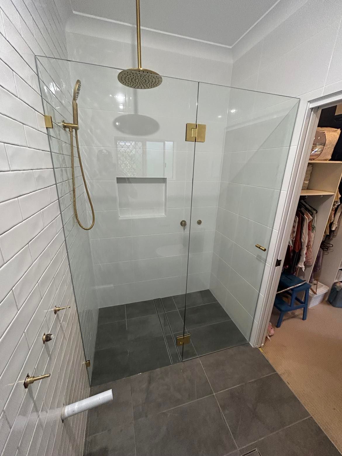Modern Shower Stall with Gold Fixtures and Gray Tile — Envy Glass in Nambucca Heads, NSW
