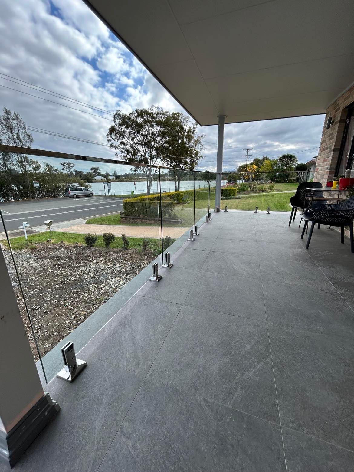 Balcony with Glass Railing Overlooking a Street — Envy Glass in Nambucca Heads, NSW