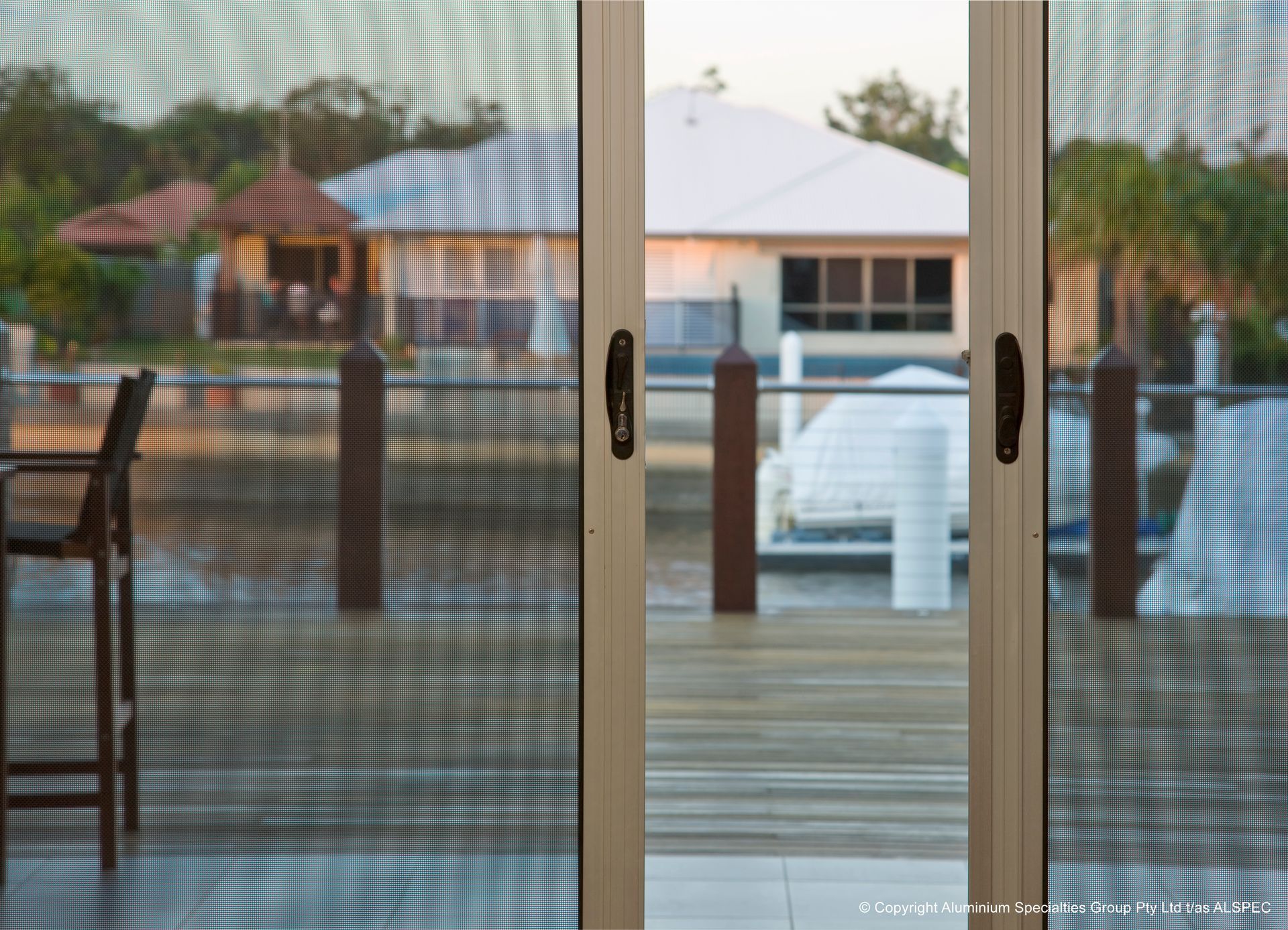 Screen Door View Of A Deck And A House, Seen Through The Mesh — Envy Glass in Macksville, NSW