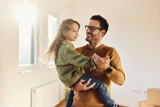 Man Holding His Daughter | Murphy, TX | EG Insurance Group