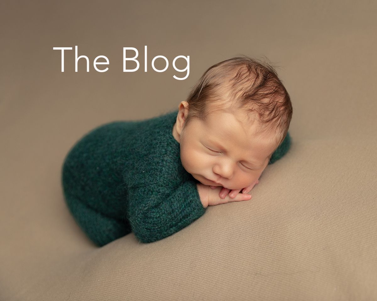 Newborn in green with The Blog header