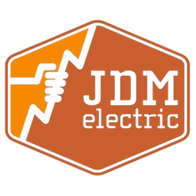 An orange and white logo for jdm electric