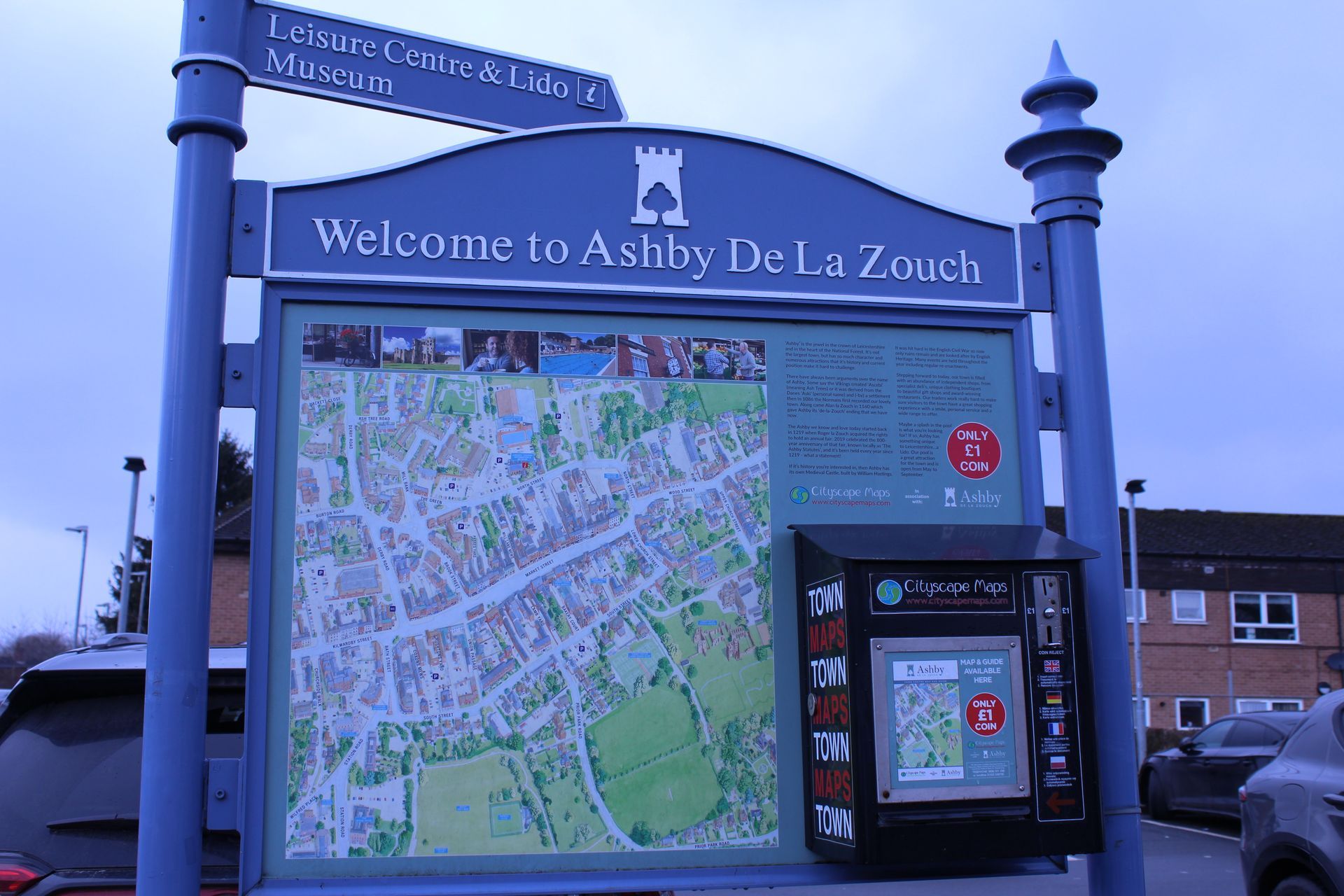 A welcome to ashby de la zouch sign with a map