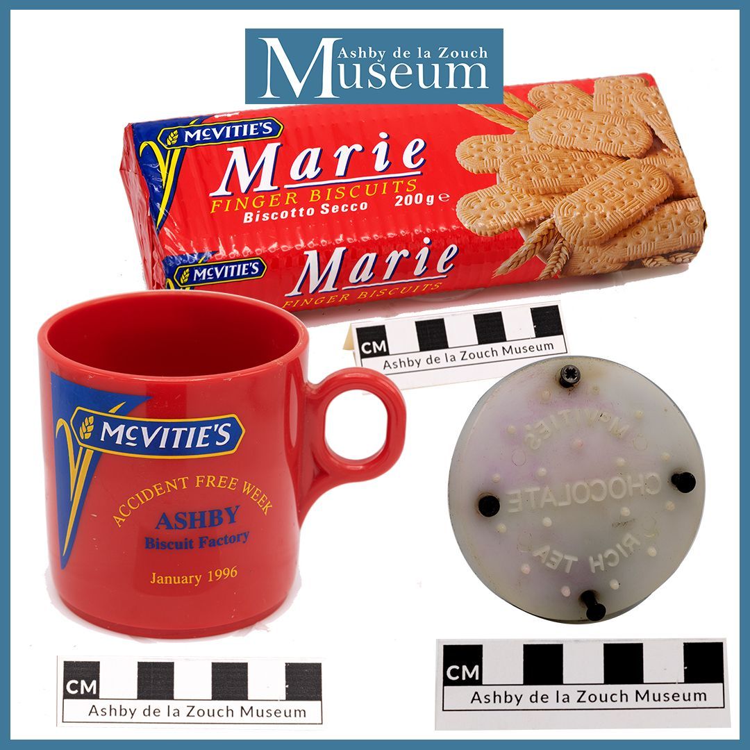 Wooden gong with mallet, and brass bell suspended from a frame.