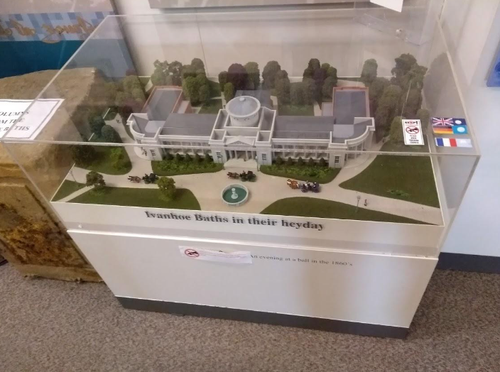 A model of the white house in a glass case