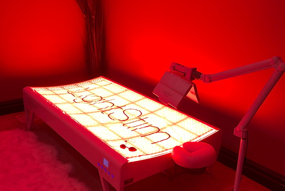 A bed in a room with a lamp and a sign that says ' i love you ' on it