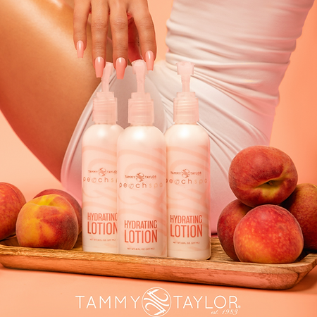 Three bottles of tammy taylor hydrating lotion are sitting on a wooden cutting board surrounded by peaches.