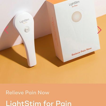 A light stimulator is sitting next to a box on a table.