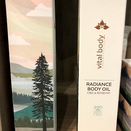 Two boxes of vital body radiance body oil