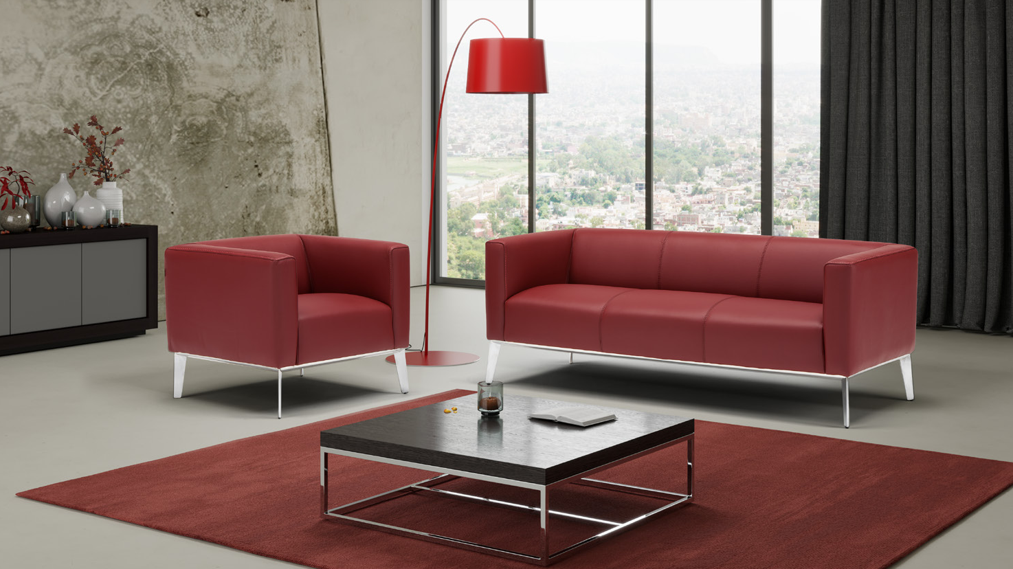 Ein Wohnzimmer mit roten Möbeln und einem Couchtisch.