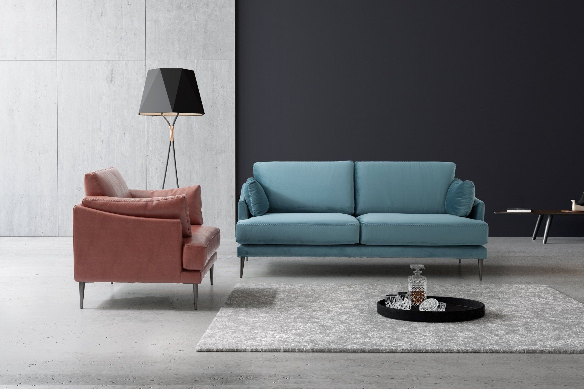 Un soggiorno con un divano blu e una sedia rosa.