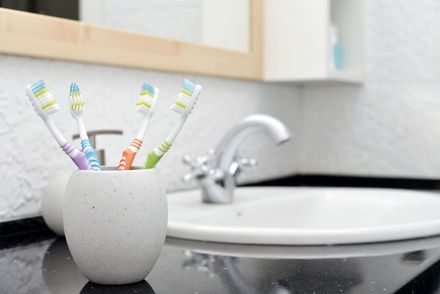 Toothbrushes in glass