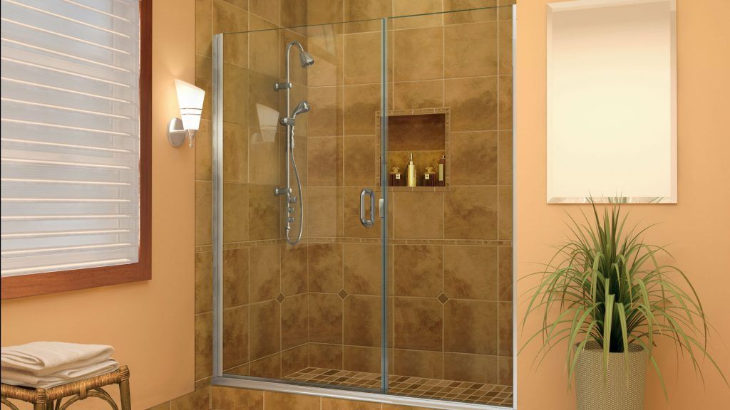 a bathroom with a sliding glass shower door
