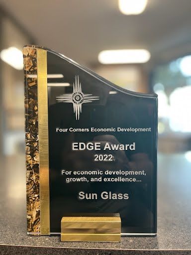 a trophy for the four corners economic development edge award for economic development , growth , and excellence .