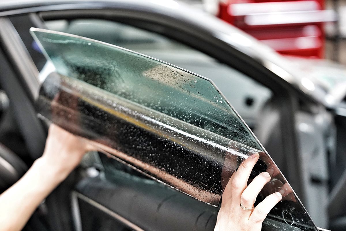 A blue car is shown before and after a one step paint correction