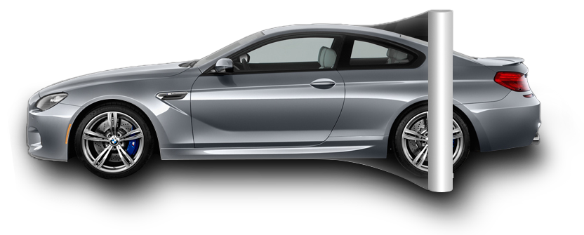 Silver sports coupe partially stopped by a white barrier pole
