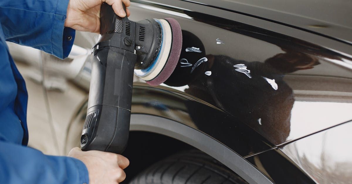 A red sports car is parked in front of a building.