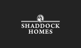 A black and white logo for shaddock homes
