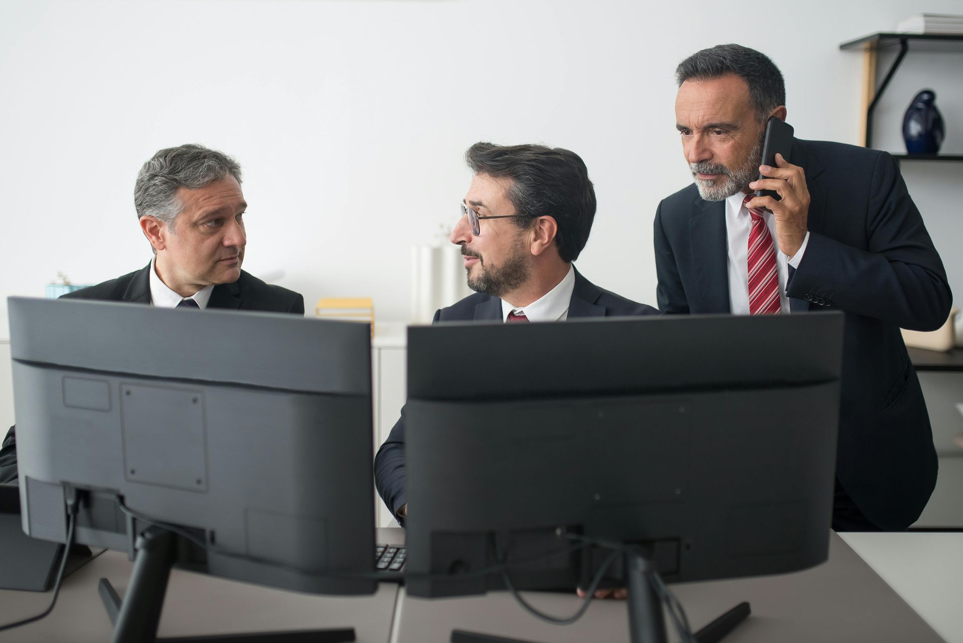 businessmen in front of the desktop computer