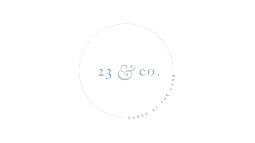 A white circle with the words `` 23 & co. '' written inside of it.