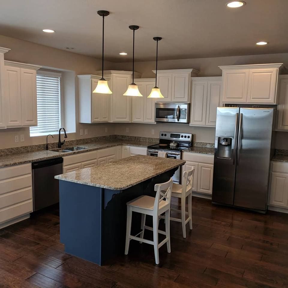 A kitchen with stainless steel appliances and granite counter tops