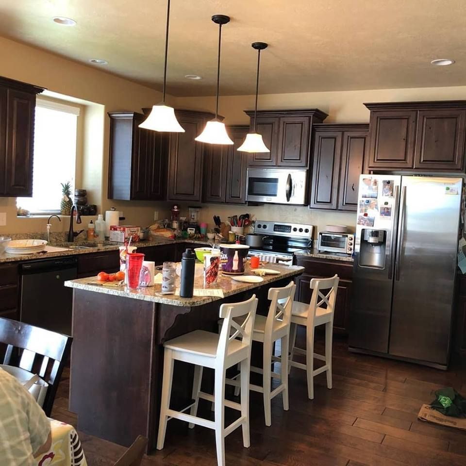 A kitchen with stainless steel appliances and a large island