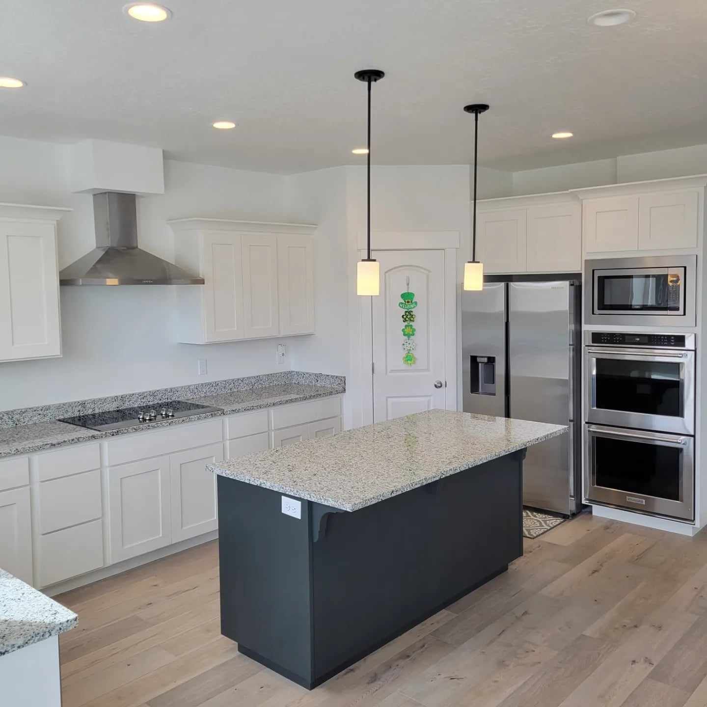 A kitchen with stainless steel appliances and granite counter tops