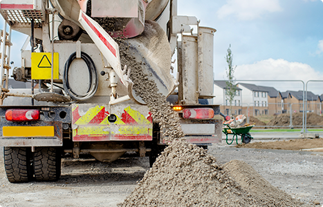 Concrete delivered to the construction site and discharged from the concrete mixing wagon truck.