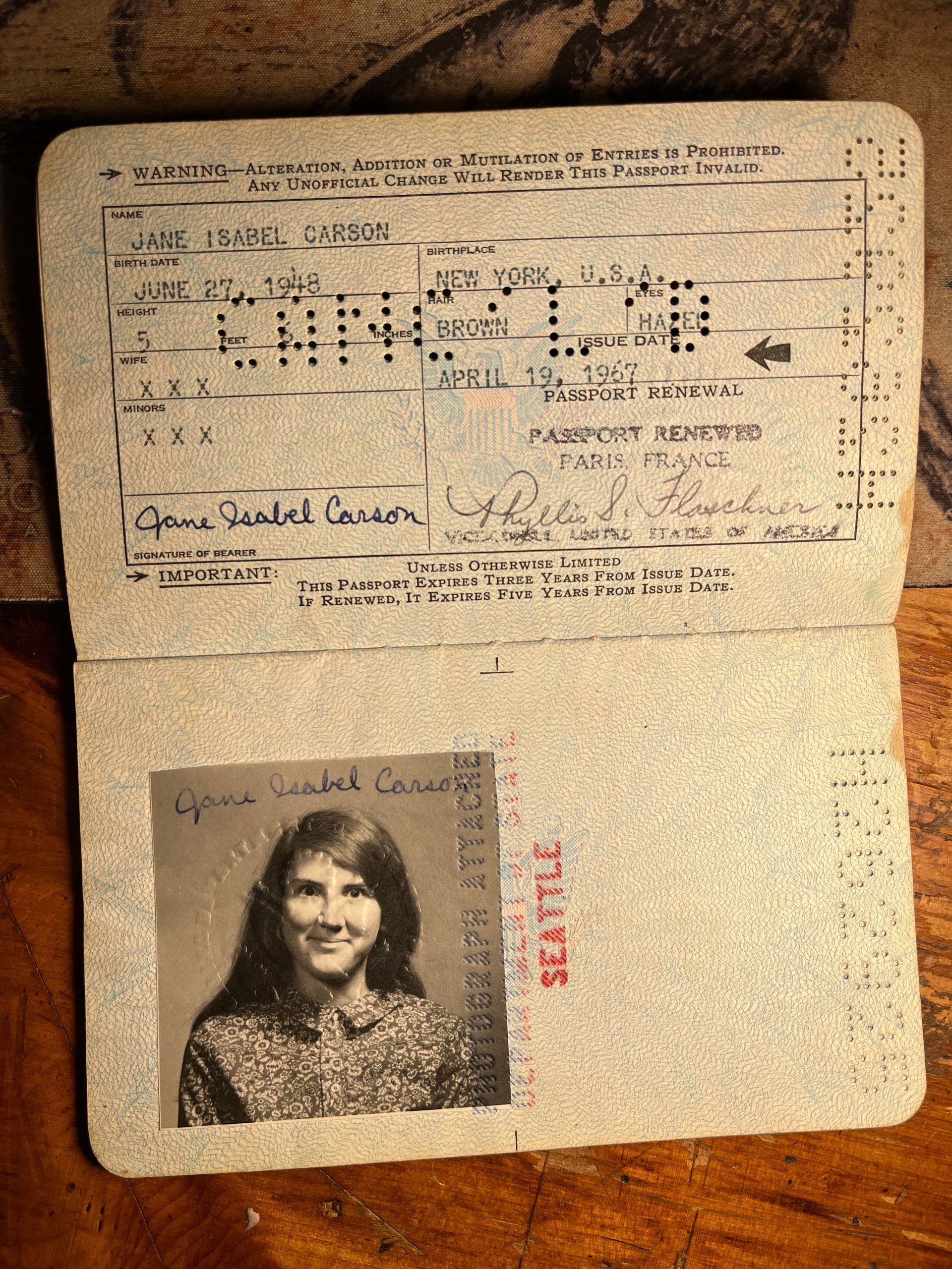 A passport with a picture of a woman on it