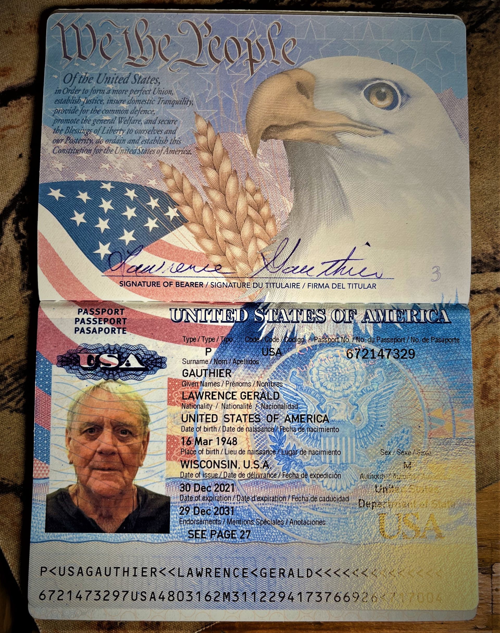 A passport with a picture of a man and an eagle on it