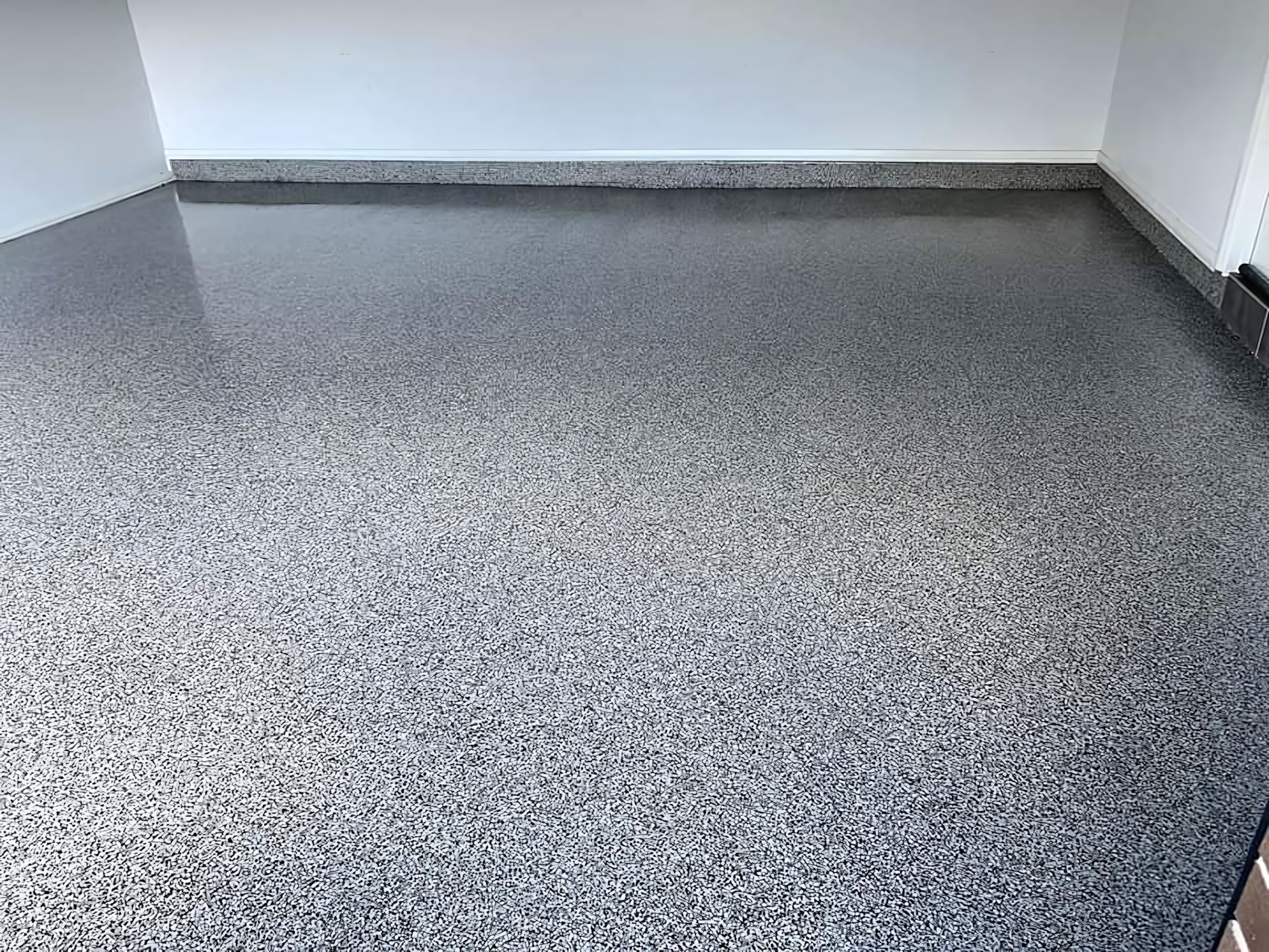 A room with a gray floor and white walls. — Partlic Painting & Epoxy Flooring In Wingham, NSW