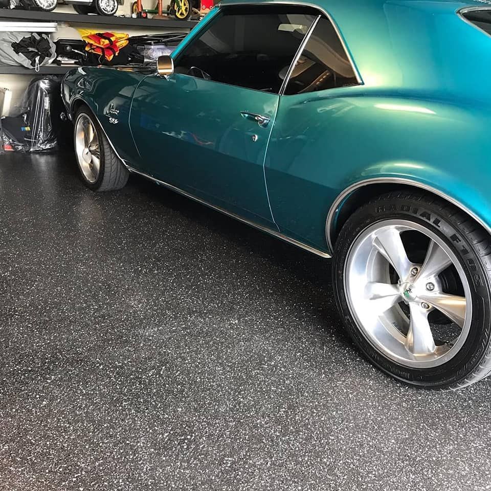 A Blue Car Is Parked In A Garage — Partlic Painting & Epoxy Flooring In Old Bar, NSW