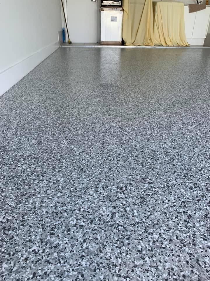 A close up of a gray concrete floor in a garage. — Partlic Painting & Epoxy Flooring In Wingham, NSW