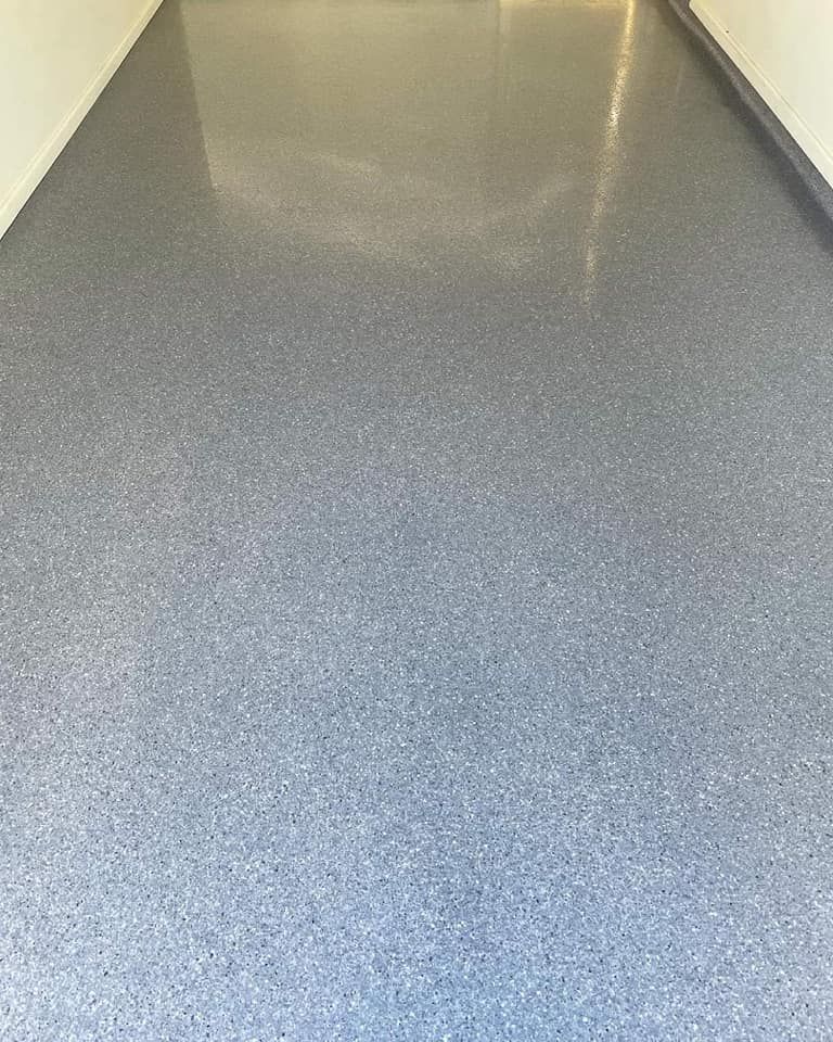 A Close Up Of A Gray Floor In A Hallway — Partlic Painting & Epoxy Flooring In Taree, NSW