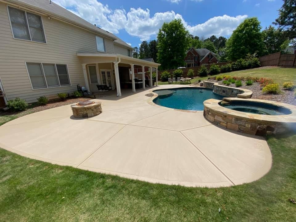 A swimming pool is being built in the backyard of a house.
