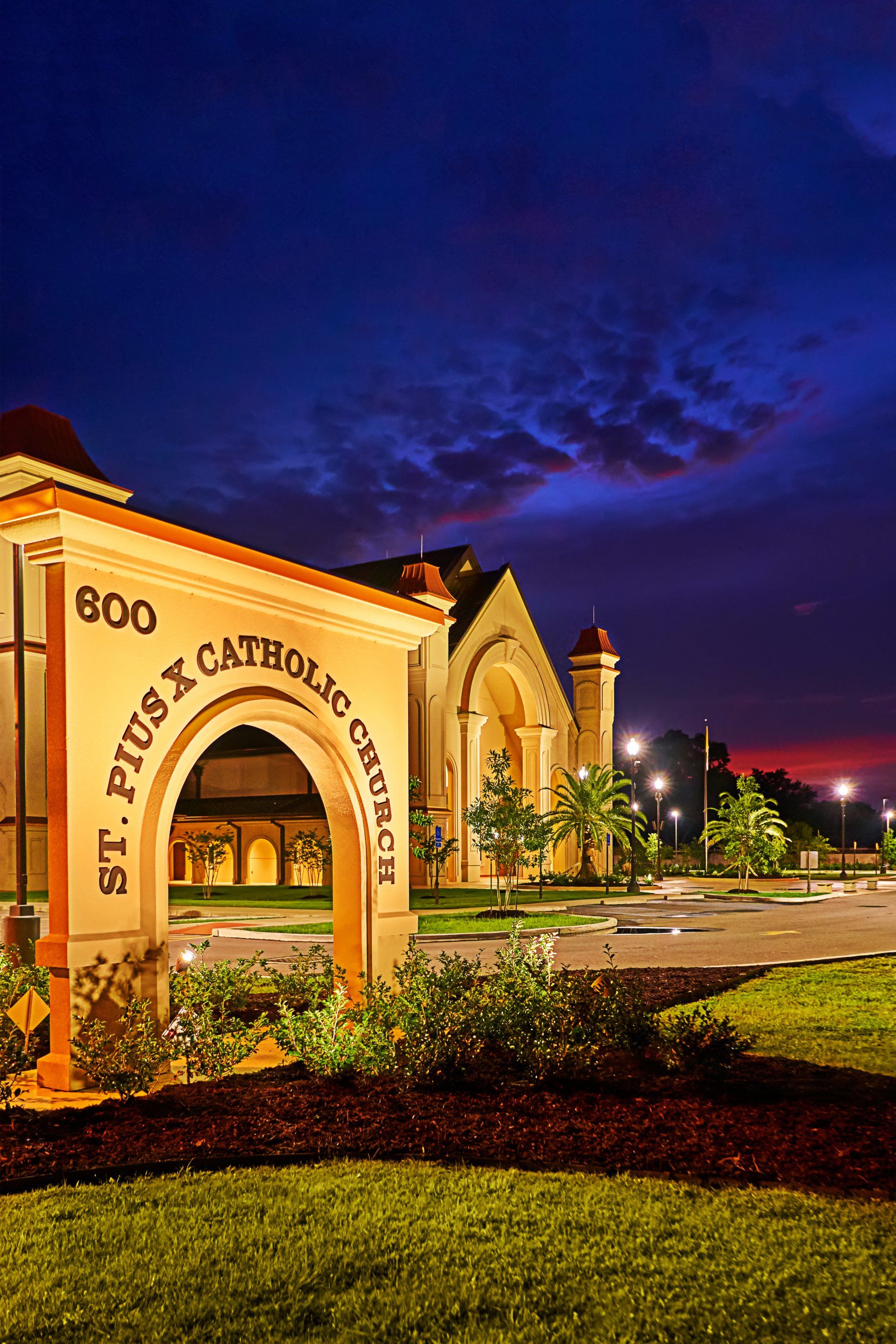 A building with a sign that says st. plus x catholic church