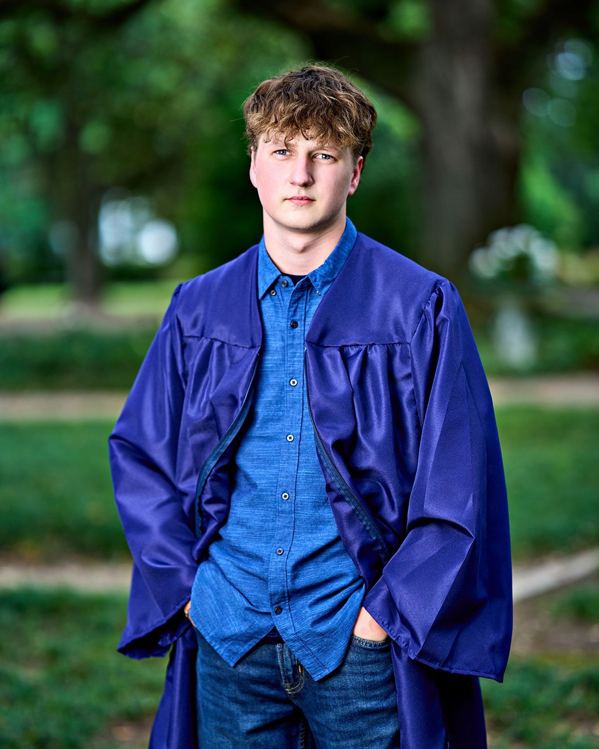 A black and white photo of a young man holding a guitar