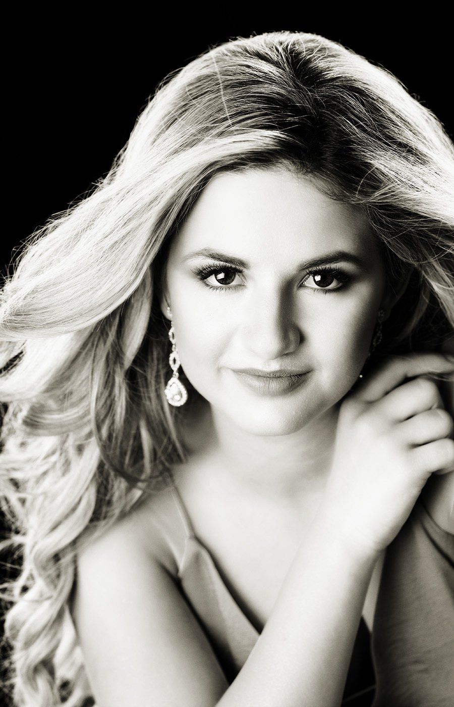 A black and white photo of a woman with long blonde hair