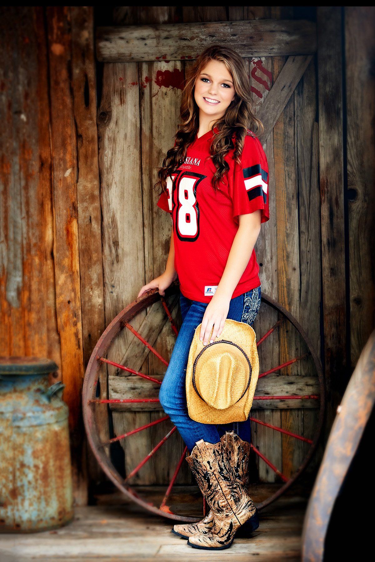 The girl is wearing a red jersey with the number 8 on it