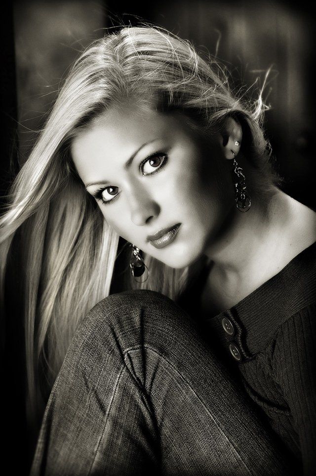 A black and white photo of a woman with long hair