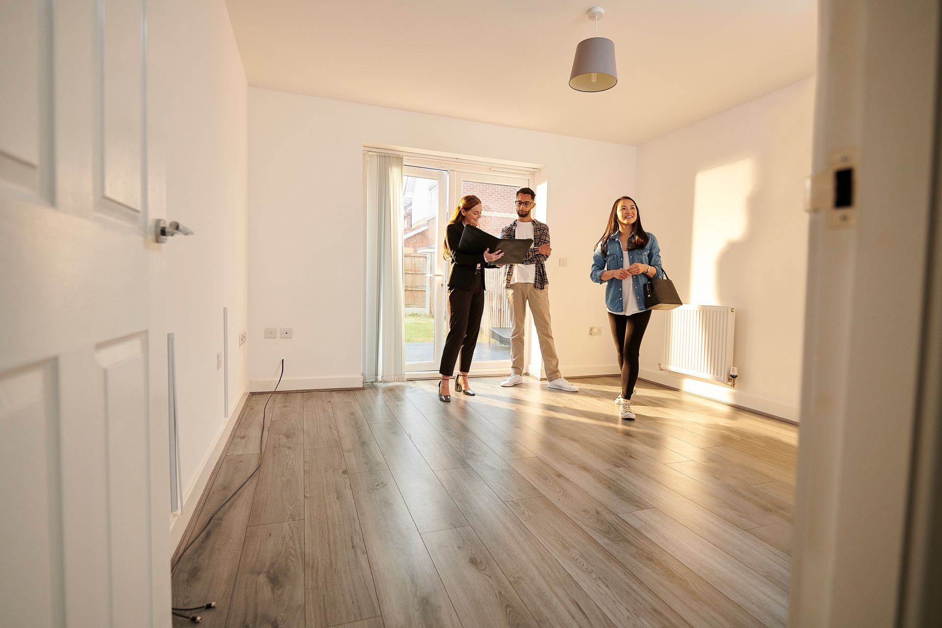 photo of a family checking out their new rental home