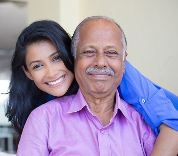 Close up portrait of a young woman and her grandfather