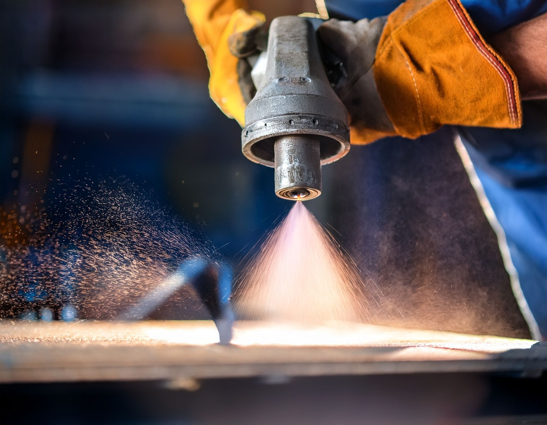 close up of industrial sandblasting process on metal surface.