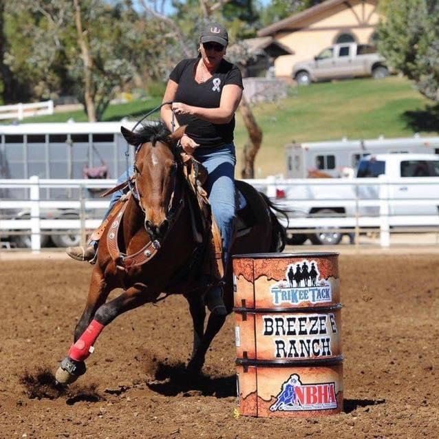 Cowgirl competes in barrel racing event, a popular equestrian sport showcased at local competitions.